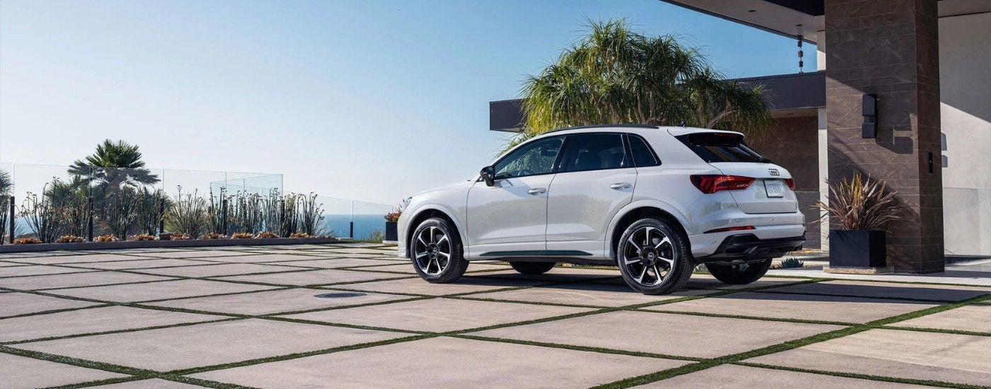 A white 2025 Audi Q5 parked on a driveway.